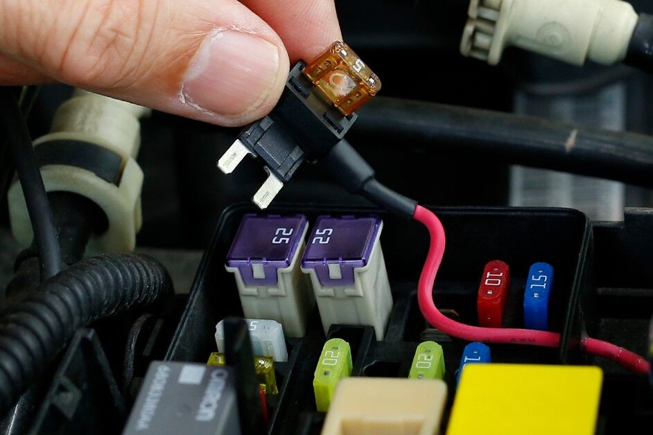 Diagram showing dual fuse taps labeled for Starlight and Ambient kits entering a single ignition fuse port with separate grounds.