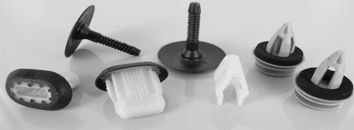 Various interior trim clips spread out on a towel