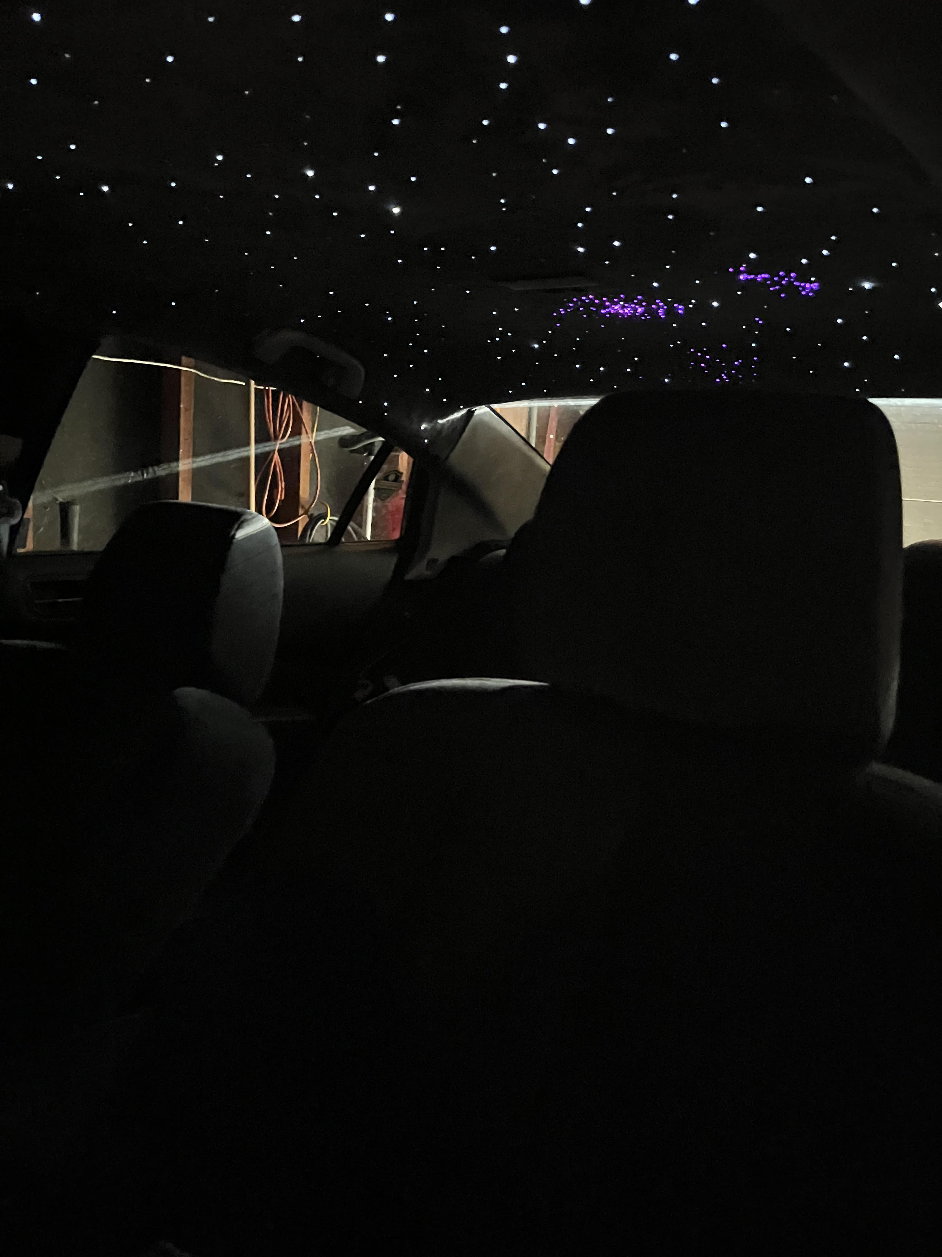 Reinstalling a vehicle headliner – trim and wiring reconnection in progress