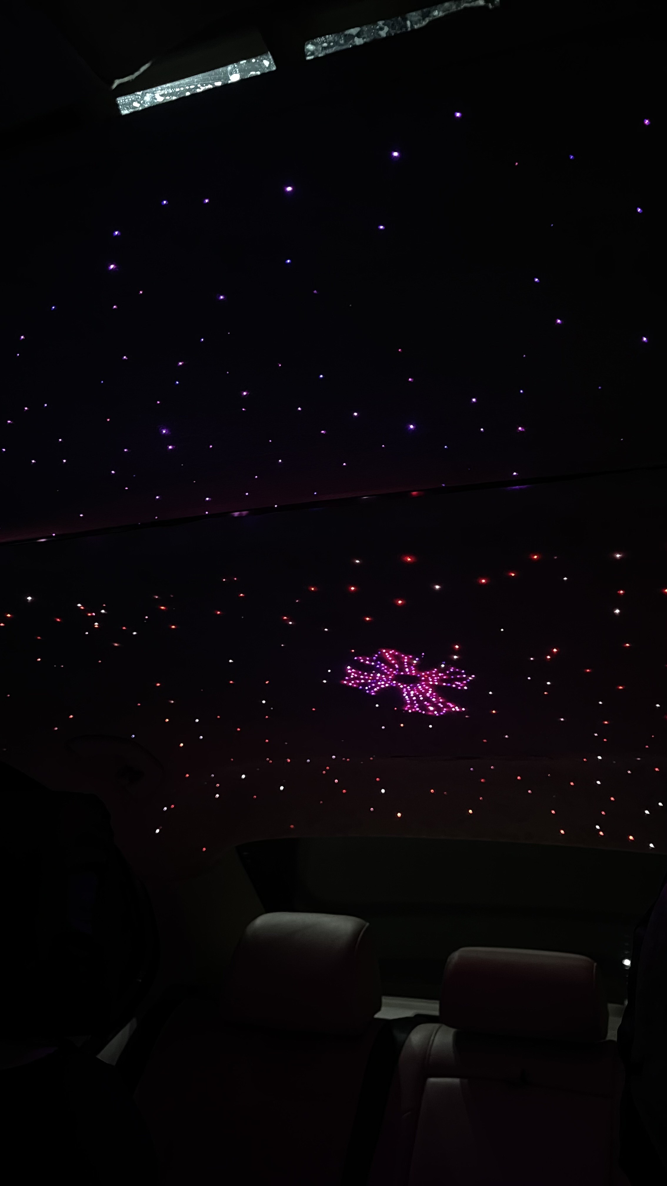 Full headliner and sunroof panel glowing RGB